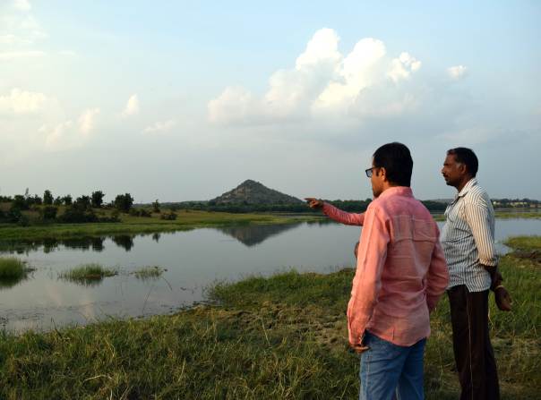 Water activists and farmer Gaju Rawat look over Lake Nilona in Yavatmal, India.